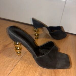 Chic Black Heels with Gold Accents